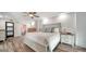Inviting bedroom with neutral tones, wood-look floors, and ensuite bath access at 101 S Gulfstream Ave # 16K, Sarasota, FL 34236