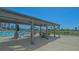 Outdoor seating area with a pergola and a view of the stunning swimming pool at 101 S Gulfstream Ave # 16K, Sarasota, FL 34236