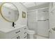 Tastefully updated bathroom featuring modern fixtures, a vanity with storage, and a glass-enclosed shower at 1216 58Th W St, Bradenton, FL 34209