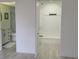 This bedroom has wood-look flooring, an ensuite bathroom, and a large closet at 1216 58Th W St, Bradenton, FL 34209