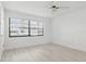Bright bedroom featuring neutral paint and large windows bringing in light to the space at 1216 58Th W St, Bradenton, FL 34209