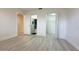 Bright bedroom boasts wood-look floors, a walk-in closet, and ensuite bathroom at 1216 58Th W St, Bradenton, FL 34209
