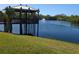 Relaxing community pond with a fountain and shaded pavilion at 1216 58Th W St, Bradenton, FL 34209