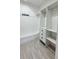 Spacious walk-in closet featuring custom shelving, drawers, and ample hanging space with neutral decor at 1216 58Th W St, Bradenton, FL 34209