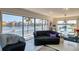 Living room with waterfront views, comfortable seating, and modern décor, creating an inviting space at 1241 Big Oak Ln, Sarasota, FL 34242