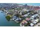Beautiful waterfront homes with pools and docks on a canal, surrounded by lush landscaping and clear water at 1241 Big Oak Ln, Sarasota, FL 34242
