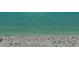 This captures expansive beach views, and clear turquoise waters offering a serene coastal experience at 131 Garfield Dr # 4D, Sarasota, FL 34236