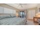Cozy bedroom with access to balcony, complemented by neutral tones, soft bedding, and bright natural light at 131 Garfield Dr # 4D, Sarasota, FL 34236