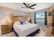 Bedroom featuring a wooden bed frame, side tables, and a view of the outdoors at 1325 Bottlebrush Dr, Bradenton, FL 34208