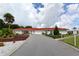 Beautiful clubhouse with a red tile roof and circular driveway at 1325 Bottlebrush Dr, Bradenton, FL 34208