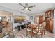 Dining area showcasing a wooden table, chairs, hutch, and a wall-mounted TV at 1325 Bottlebrush Dr, Bradenton, FL 34208
