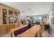 Open-concept dining area featuring a classic wooden table and chairs, connecting to the living space with decor at 1325 Bottlebrush Dr, Bradenton, FL 34208