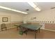 Well-lit game room featuring a ping pong table, ideal for recreational activities and friendly competition at 1325 Bottlebrush Dr, Bradenton, FL 34208