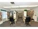 Cozy library space with rows of bookshelves and comfortable seating for reading and relaxation at 1325 Bottlebrush Dr, Bradenton, FL 34208