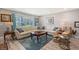 Bright living room featuring leather seating, stylish side tables, and a clear view of the outdoor scenery at 1325 Bottlebrush Dr, Bradenton, FL 34208