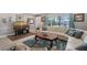 Well-lit living room featuring comfortable leather seating, modern furnishings, and a bright view to the outdoors at 1325 Bottlebrush Dr, Bradenton, FL 34208