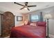 Comfortable main bedroom features a ceiling fan, closet, a window, and decorative hutch at 1325 Bottlebrush Dr, Bradenton, FL 34208