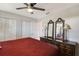 Comfortable main bedroom features a ceiling fan, large closet, and dresser with mirrors at 1325 Bottlebrush Dr, Bradenton, FL 34208