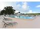 Sparkling outdoor pool with lounge chairs, offering a relaxing and refreshing retreat for residents at 1325 Bottlebrush Dr, Bradenton, FL 34208