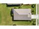 Bird's eye view of a well-maintained home with a manicured lawn and surrounding greenery at 16966 Rosedown Gln, Parrish, FL 34219