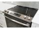 Modern kitchen featuring a stainless steel glass cooktop with white countertop at 16966 Rosedown Gln, Parrish, FL 34219