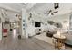Bright living room featuring stylish decor, modern furnishings, and tile floors at 16966 Rosedown Gln, Parrish, FL 34219