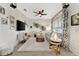Bright living room featuring stylish decor, modern furnishings, and tile floors at 16966 Rosedown Gln, Parrish, FL 34219