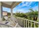 Inviting front porch seating area overlooking lush landscaping at 16966 Rosedown Gln, Parrish, FL 34219