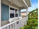 Inviting front porch seating area overlooking lush landscaping at 16966 Rosedown Gln, Parrish, FL 34219