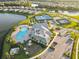 Community featuring a pool, clubhouse, tennis courts, playground, and scenic lake views at 17045 Polo Trl, Bradenton, FL 34211