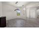 Dining room featuring wood floors, modern light fixture and large window for natural light at 17045 Polo Trl, Bradenton, FL 34211