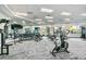 Community gym with mirrored walls, various weight machines, free weights, and a stationary bike at 17045 Polo Trl, Bradenton, FL 34211