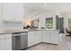 Bright kitchen with stainless steel appliances and granite countertops, overlooking an outdoor space at 17045 Polo Trl, Bradenton, FL 34211