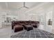 Spacious living room with leather sectional and open floor plan to kitchen at 17045 Polo Trl, Bradenton, FL 34211