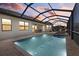 Screened in lanai with pool and hot tub area, as well as outdoor seating at 17045 Polo Trl, Bradenton, FL 34211