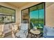 Relaxing balcony with comfortable seating overlooking a picturesque view at 17902 Gawthrop Dr # 302, Lakewood Ranch, FL 34211