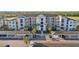 Well-maintained condo building featuring covered parking and manicured landscaping at 17902 Gawthrop Dr # 302, Lakewood Ranch, FL 34211