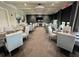 The restaurant dining room is a stylish setting with soft neutral tones, creating a welcoming and comfortable atmosphere at 17902 Gawthrop Dr # 302, Lakewood Ranch, FL 34211