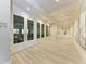 Hallway leading to the Palmer room, showcasing the interior's clean lines and inviting design at 17902 Gawthrop Dr # 302, Lakewood Ranch, FL 34211