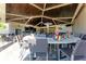 Charming outdoor bar with ample seating, granite countertop, and plenty of space to relax with a refreshing beverage at 17902 Gawthrop Dr # 302, Lakewood Ranch, FL 34211