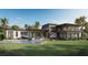 Expansive backyard featuring a pool, patio, and outdoor living area perfect for relaxation at 2100 Mcclellan Pkwy, Sarasota, FL 34239