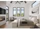 Serene main bedroom with vaulted ceilings, fireplace, large windows offering an abundance of natural light at 2100 Mcclellan Pkwy, Sarasota, FL 34239