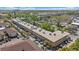 Aerial view of the building and surrounding parking with beautiful landscaping and green spaces at 2155 Wood St # A20, Sarasota, FL 34237