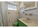 Bathroom featuring a green vanity and sink, medicine cabinet and shower with curtain at 2155 Wood St # A20, Sarasota, FL 34237