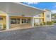 Condominium building entrance with covered area and signage, showcasing the building's facade at 2155 Wood St # A20, Sarasota, FL 34237