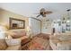 Inviting living room with a sofa, stylish mirror, and a view into the dining area at 2155 Wood St # A20, Sarasota, FL 34237