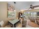 Bright living room featuring a dining table, comfortable seating, and access to an outdoor patio at 2155 Wood St # A20, Sarasota, FL 34237