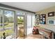 Enclosed patio offering a serene view of the landscaped surroundings and outdoor access at 2155 Wood St # A20, Sarasota, FL 34237