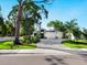 Elegant home boasts a three-car garage, manicured landscaping, and a stylish entrance at 2246 Webber St, Sarasota, FL 34239