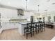 Bright kitchen boasts a large island with seating, stainless steel appliances, and sleek countertops at 2246 Webber St, Sarasota, FL 34239
